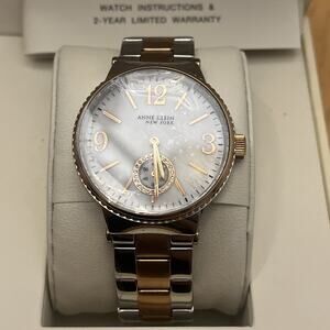 $240 MSRP | Anne Klein Woman's Two Tone MOP Dial Watch - 12/2341MPRT